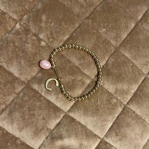BaubleBar gold bead bracelet with charms